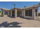 Backyard featuring a brick patio and a covered area; tall palm trees and string lighting at 1826 W Oriole Way, Chandler, AZ 85286