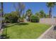 Spacious backyard featuring a well-maintained lawn and lush landscaping for outdoor enjoyment at 1826 W Oriole Way, Chandler, AZ 85286