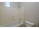 Bathroom featuring a tub and shower combination with a white toilet at 1826 W Oriole Way, Chandler, AZ 85286