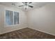 Neutral bedroom with carpeted floors, ceiling fan, and window with plantation shutters at 1826 W Oriole Way, Chandler, AZ 85286