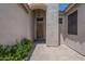 Inviting front entrance with a covered walkway, desert landscaping, and stylish lighting fixture at 1826 W Oriole Way, Chandler, AZ 85286