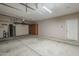 Spacious three car garage with built-in cabinets, storage racks, and high ceilings at 1826 W Oriole Way, Chandler, AZ 85286