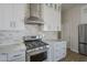 Close-up view of a kitchen with stainless steel appliances and white cabinets at 1826 W Oriole Way, Chandler, AZ 85286