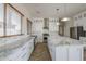 Bright modern kitchen with stainless appliances, marble countertops, and ample storage at 1826 W Oriole Way, Chandler, AZ 85286