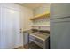 Functional laundry room with modern washer and dryer, stylish wallpaper at 1826 W Oriole Way, Chandler, AZ 85286