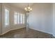 Inviting living room with wood-look floors, white paint, plantation shutters, and chandelier at 1826 W Oriole Way, Chandler, AZ 85286