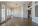 Spacious living room with wood-look floors, neutral paint and plantation shutters at 1826 W Oriole Way, Chandler, AZ 85286
