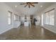 Living room and kitchen area with wood-look flooring and natural lighting from the surrounding windows at 1826 W Oriole Way, Chandler, AZ 85286
