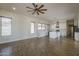 Open floor plan showing living room and kitchen with wood-look flooring and lots of light at 1826 W Oriole Way, Chandler, AZ 85286