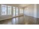 Spacious living room featuring wood-look floors, an open layout, and access to the backyard at 1826 W Oriole Way, Chandler, AZ 85286