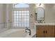 Beautiful bathroom featuring a soaking tub and a glass block window at 1826 W Oriole Way, Chandler, AZ 85286