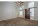 Open main bedroom showcasing a ceiling fan and access to the bathroom at 1826 W Oriole Way, Chandler, AZ 85286