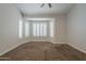 Carpeted main bedroom with bay windows and plantation shutters at 1826 W Oriole Way, Chandler, AZ 85286