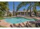 Backyard pool and patio with views of the house and lush landscaping at 1826 W Oriole Way, Chandler, AZ 85286