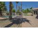 Gated pool area surrounded by lush landscaping, gravel, and a brick patio at 1826 W Oriole Way, Chandler, AZ 85286