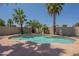 Backyard pool with lush landscaping, palm trees, and cool blue water at 1826 W Oriole Way, Chandler, AZ 85286