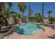 Backyard pool with lush landscaping, palm trees, and a fenced in back patio at 1826 W Oriole Way, Chandler, AZ 85286