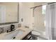 Bathroom featuring a white vanity and a shower-tub combo at 18402 E Oak Hill Ln, Queen Creek, AZ 85142