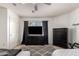 Bedroom with black dresser, TV, ceiling fan, and plush rug at 18402 E Oak Hill Ln, Queen Creek, AZ 85142