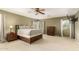 Spacious bedroom featuring a ceiling fan, natural light, and neutral tones at 18402 E Oak Hill Ln, Queen Creek, AZ 85142