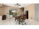 Cozy dining area with natural light, access to the backyard, and modern furnishings at 18402 E Oak Hill Ln, Queen Creek, AZ 85142