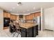 Open kitchen with a large center island, stainless steel appliances, and ample cabinet space at 18402 E Oak Hill Ln, Queen Creek, AZ 85142