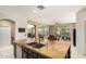 Bright and airy kitchen featuring a large island, open layout, and views to the backyard at 18402 E Oak Hill Ln, Queen Creek, AZ 85142