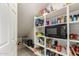 Walk-in pantry with ample white shelving and tile flooring offers plenty of storage space at 18402 E Oak Hill Ln, Queen Creek, AZ 85142
