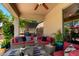 Inviting outdoor patio with comfortable seating and shade covering at 18402 E Oak Hill Ln, Queen Creek, AZ 85142