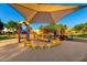 Well-maintained playground under shade, featuring a variety of play equipment for  at 18402 E Oak Hill Ln, Queen Creek, AZ 85142