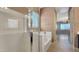 Bathroom with glass-enclosed shower, separate tub, and neutral decor at 18617 W Williams St, Goodyear, AZ 85338
