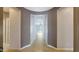 Tiled entryway that leads into a bright living room at 18617 W Williams St, Goodyear, AZ 85338