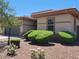 Charming single-story home featuring a well-maintained yard and neutral color scheme at 18617 W Williams St, Goodyear, AZ 85338