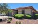 Single-story home with desert landscaping and trimmed bushes at 18617 W Williams St, Goodyear, AZ 85338