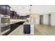 Spacious kitchen with stainless appliances, granite countertops, and center island at 18617 W Williams St, Goodyear, AZ 85338