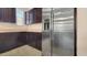Close-up of a stainless steel refrigerator and granite countertops at 18617 W Williams St, Goodyear, AZ 85338