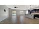 Open concept living space with large tile flooring and natural light at 18617 W Williams St, Goodyear, AZ 85338