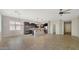 Open concept living space with large tile flooring and a ceiling fan at 18617 W Williams St, Goodyear, AZ 85338