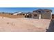 Expansive backyard featuring a covered patio, providing a blank canvas for landscaping and outdoor enjoyment at 18778 E Panchito Dr, Gold Canyon, AZ 85118