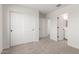 This spacious carpeted bedroom includes a sliding closet and doorway to the bathroom, providing convenience and style at 18778 E Panchito Dr, Gold Canyon, AZ 85118