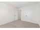 This is a carpeted bedroom with neutral walls and white doors, offering a serene and comfortable space at 18778 E Panchito Dr, Gold Canyon, AZ 85118