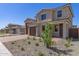 Charming home featuring a two-car garage and a beautifully landscaped front yard at 18778 E Panchito Dr, Gold Canyon, AZ 85118