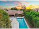 Aerial view of the backyard featuring a large pool with mature landscaping around the property at 19275 N 88Th Way, Scottsdale, AZ 85255