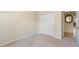 Neutral colored bedroom featuring carpet, closet, and access to other rooms at 19275 N 88Th Way, Scottsdale, AZ 85255