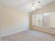 Neutral colored bedroom featuring carpet, ceiling fan, and a window bringing in lots of natural light at 19275 N 88Th Way, Scottsdale, AZ 85255