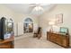 Comfortable bedroom with neutral carpet, ample natural light, and charming vintage decor at 19275 N 88Th Way, Scottsdale, AZ 85255