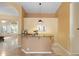 Open kitchen featuring granite countertops, tan cabinetry, and travertine tile flooring at 19275 N 88Th Way, Scottsdale, AZ 85255