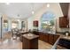 Bright kitchen area features granite countertops, travertine floors, and white shuttered windows at 19275 N 88Th Way, Scottsdale, AZ 85255