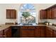 Kitchen close up featuring granite countertops and beautiful wood cabinets and stainless steel appliances at 19275 N 88Th Way, Scottsdale, AZ 85255
