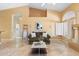 Cozy living room with tile floors, a comfortable sofa, high ceilings, and bright natural light at 19275 N 88Th Way, Scottsdale, AZ 85255